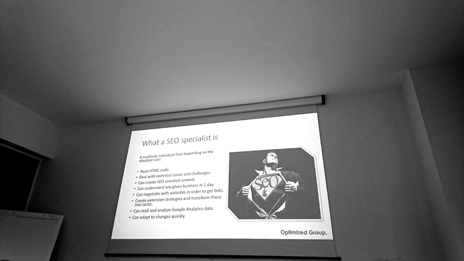 Optimized Group presentation slide explaining what an SEO specialist is