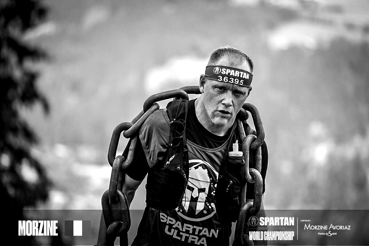 Niklas Lindahl carrying heavy chains at the Spartan Ultra World Championship in Morzine