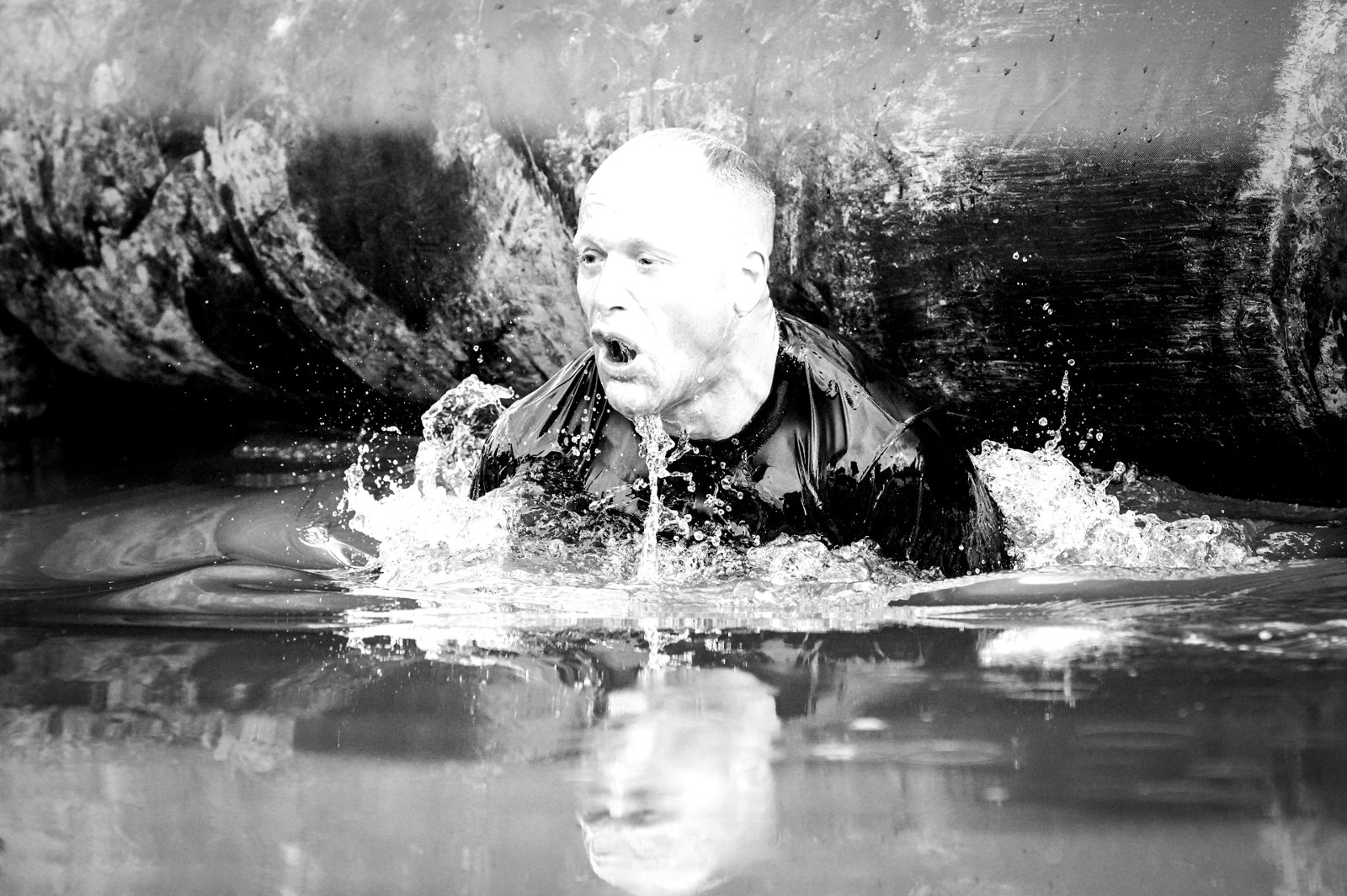 Niklas Lindahl pushing through deep water in an obstacle race